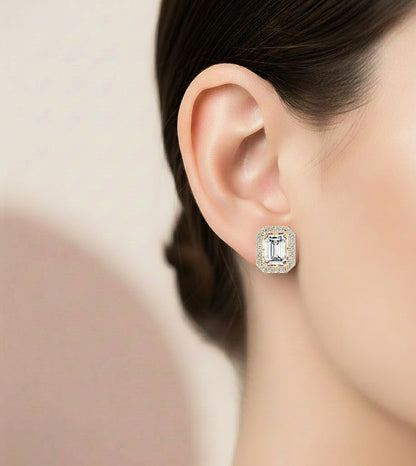 Emerald shape diamond stud earrings with round accent stones
