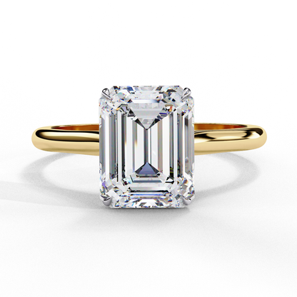 Yellow gold emerald cut diamond engagement ring with four prong setting