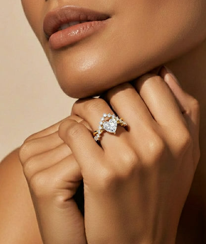 Heart shaped lab diamond ring worn on finger with yellow gold band #wearthelook