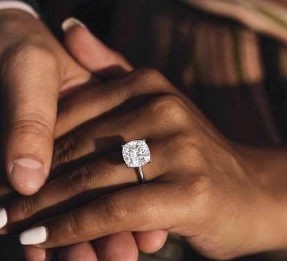 Hand wearing cushion shape solitaire lab diamond ring