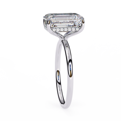 Close up of emerald cut solitaire ring with refined prong details