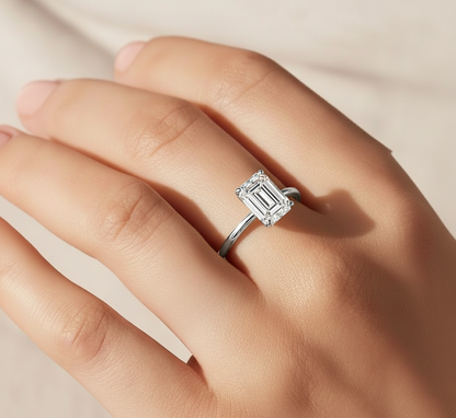 360 view video of lab grown emerald cut diamond solitaire ring rotating on white background