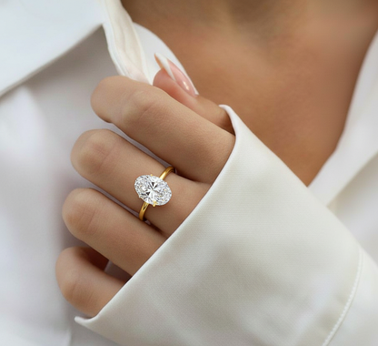 Angled view of oval cut diamond ring with polished finish