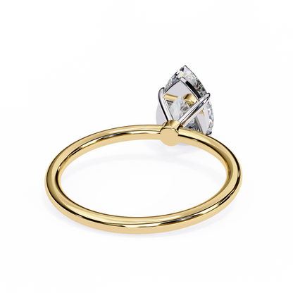 Close up of pear cut solitaire ring with refined prong details