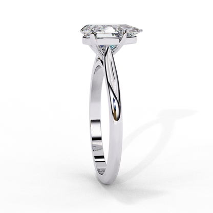 Close up of pear cut solitaire diamond ring with refined prong details