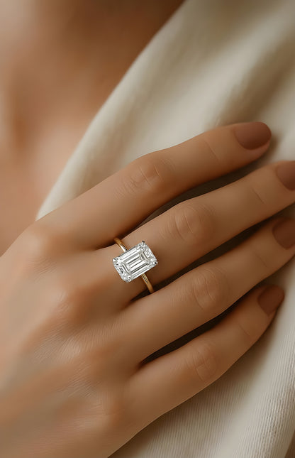 Angled view of radiant cut diamond ring with hidden halo setting