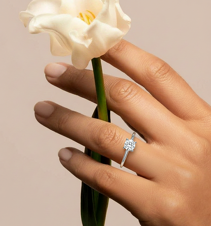 Angled view of round brilliant diamond ring with clean finish