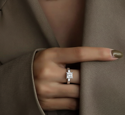 Angled view of princess cut diamond ring with polished finish