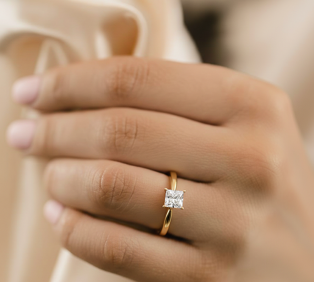Hand wearing princess shape lab diamond wedding ring
