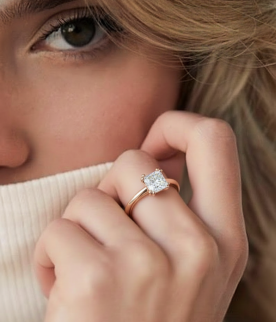 Angled view of princess cut diamond engagement ring with polished finish