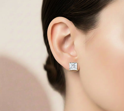 Hand and ear styling look of princess cut solitaire diamond studs