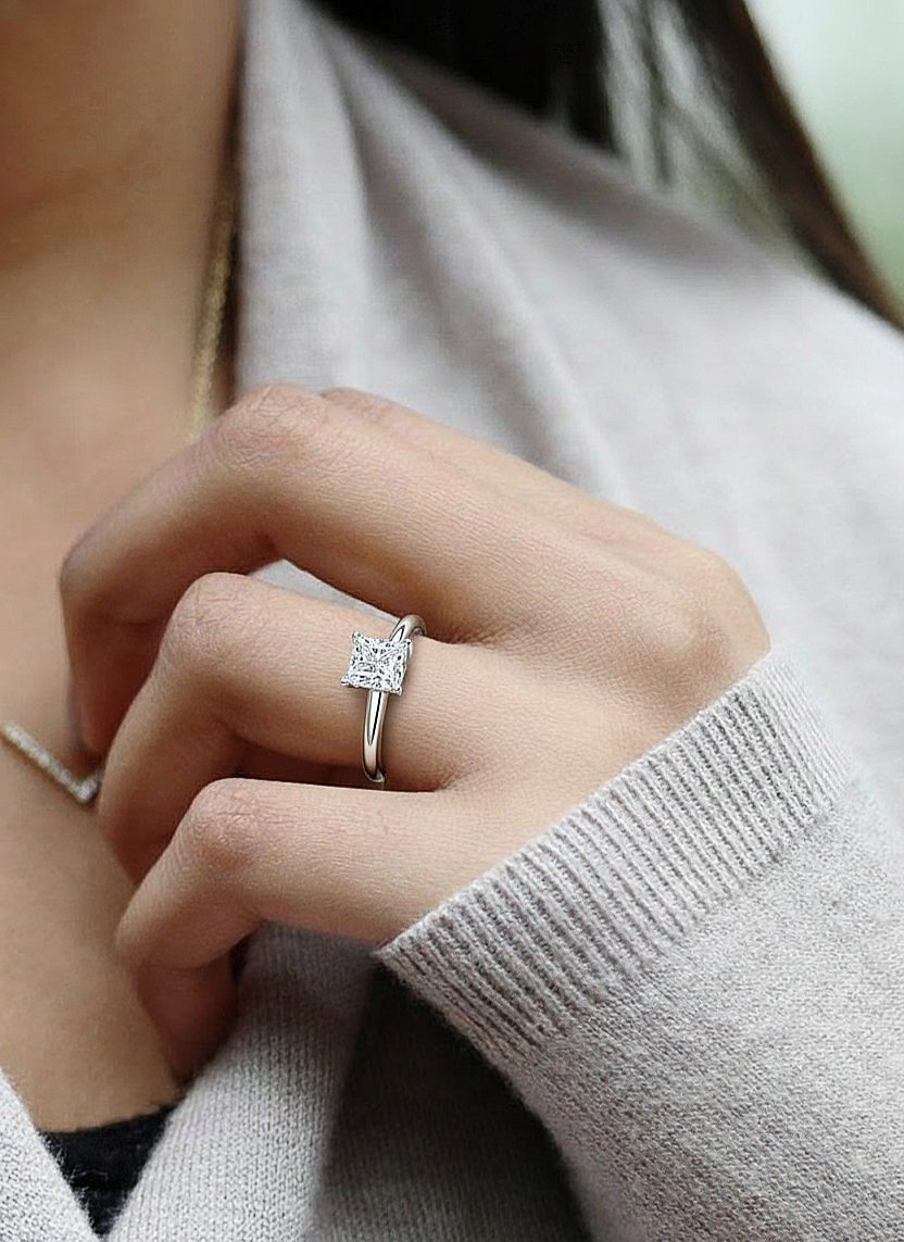 Angled view of princess cut diamond ring with clean finish