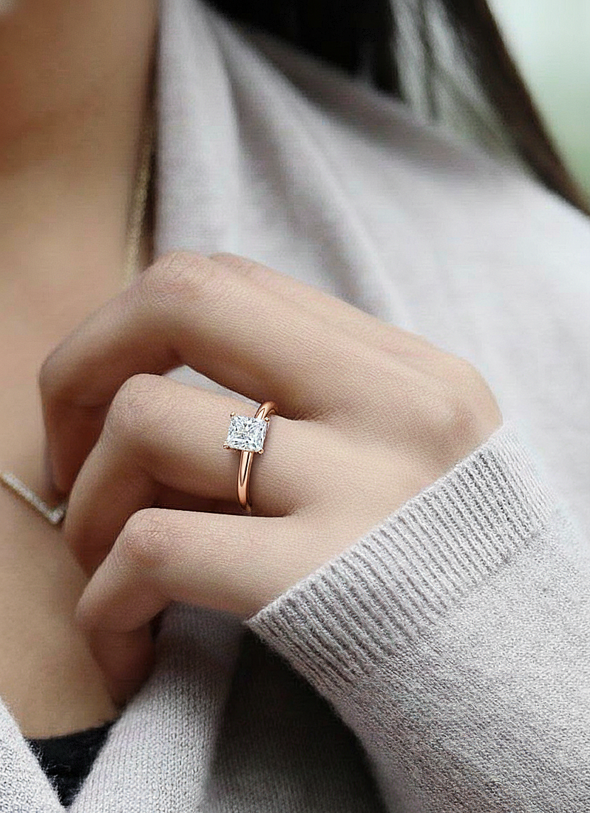 360 view video of princess cut prong set solitaire ring rotating on white background