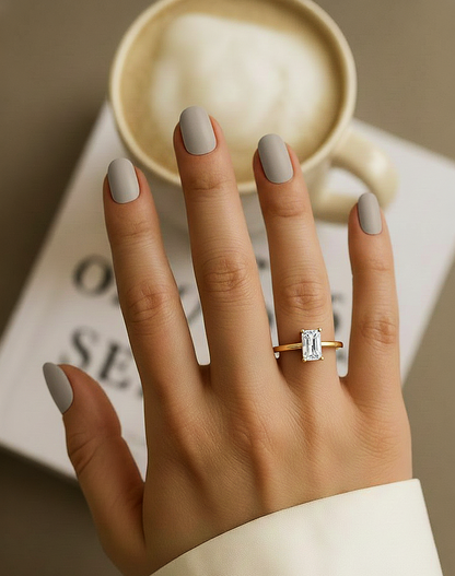 Angled view of radiant cut diamond solitaire ring with polished finish