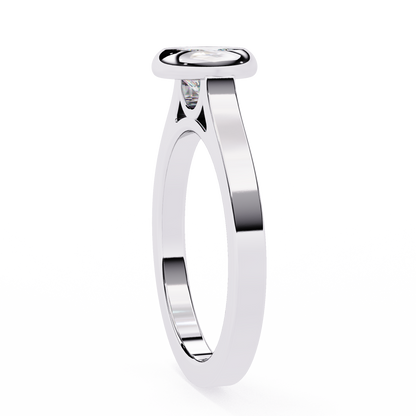 Close up of round cut bezel set solitaire ring with refined details