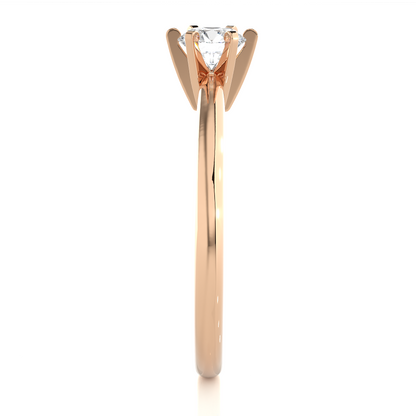 Close up of round cut solitaire ring with six prong setting details