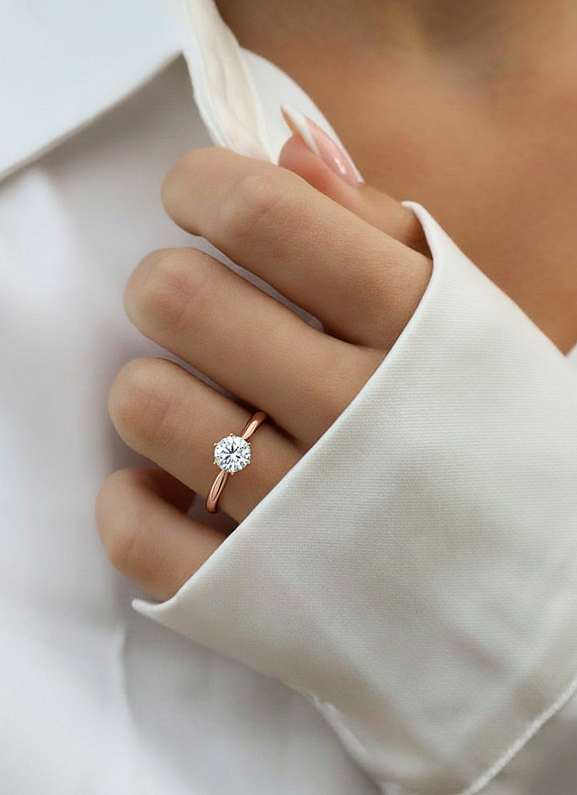 360 view video of round cut lab grown diamond engagement ring rotating on white background