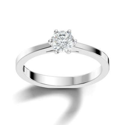 Close up of round cut solitaire ring with refined setting details