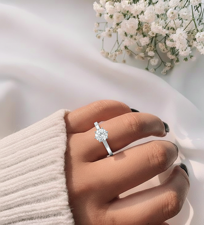 360 view video of round cut lab grown diamond solitaire engagement ring rotating on white background
