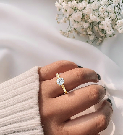 Angled view of round cut diamond engagement ring with clean finish