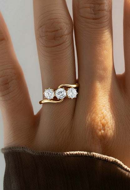 Three stone diamond wave ring worn on finger with rose gold finish #wearthelook