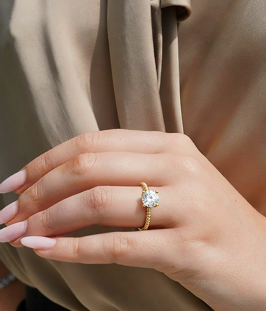 360 view video of round cut solitaire lab grown diamond engagement ring rotating on white background