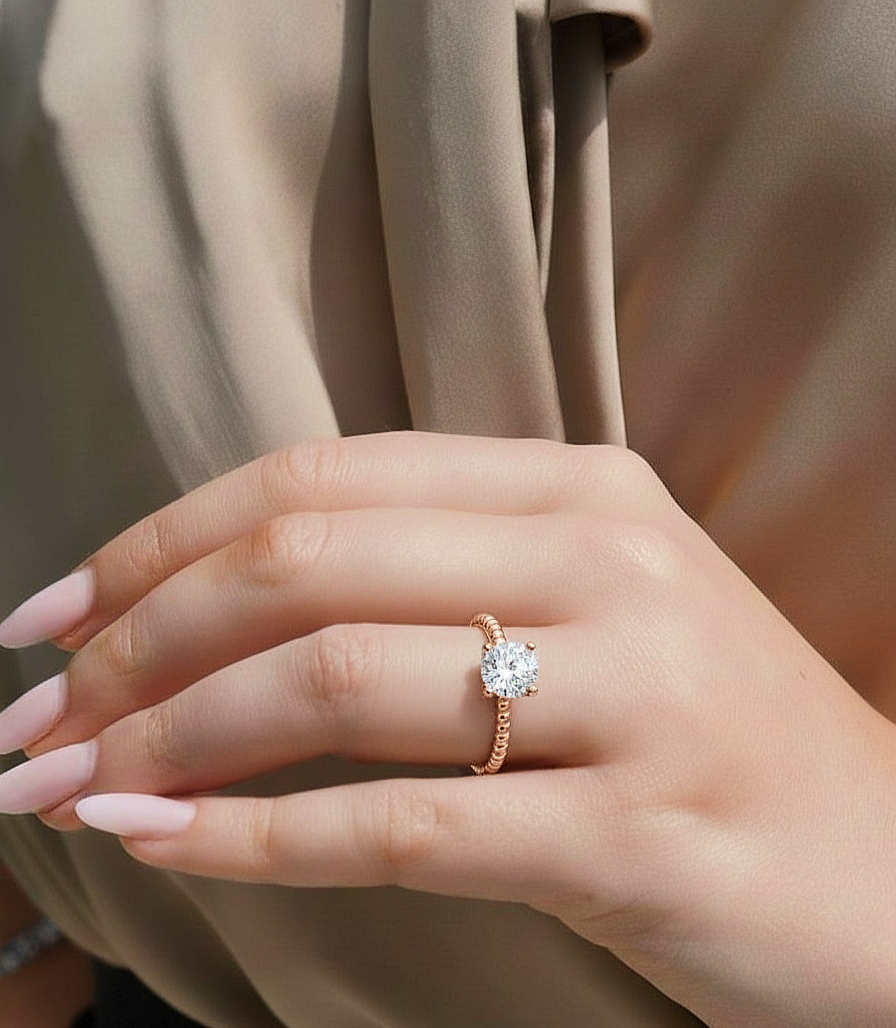 Angled view of round cut diamond engagement ring with clean finish