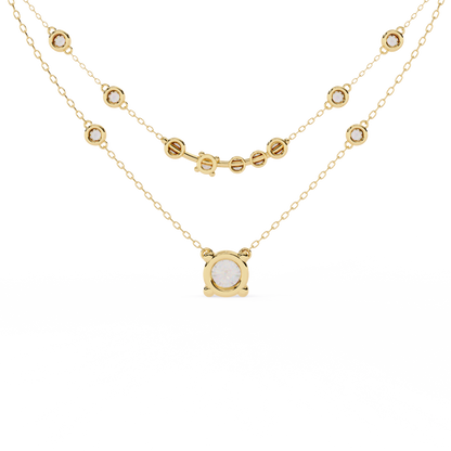 Contemporary double strand necklace with round bezel diamonds