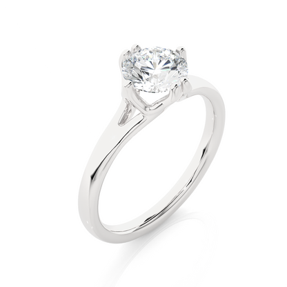 Close up of round cut solitaire ring with refined setting details