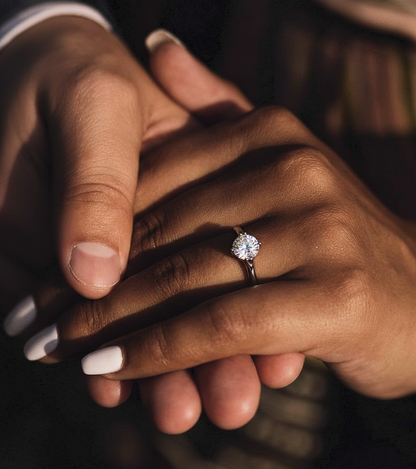 Angled view of round diamond engagement ring with clean finish