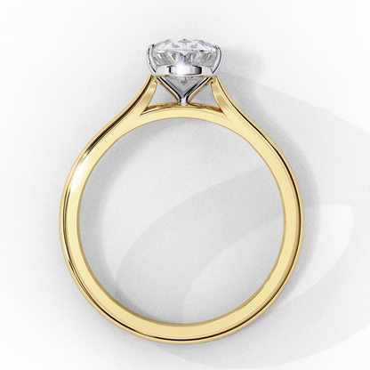 Close up of solitaire oval diamond ring with refined prong setting