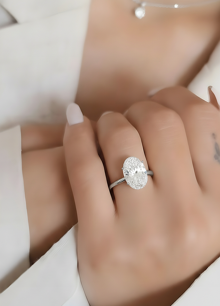 360 view video of solitaire oval cut lab grown diamond engagement ring rotating on white background