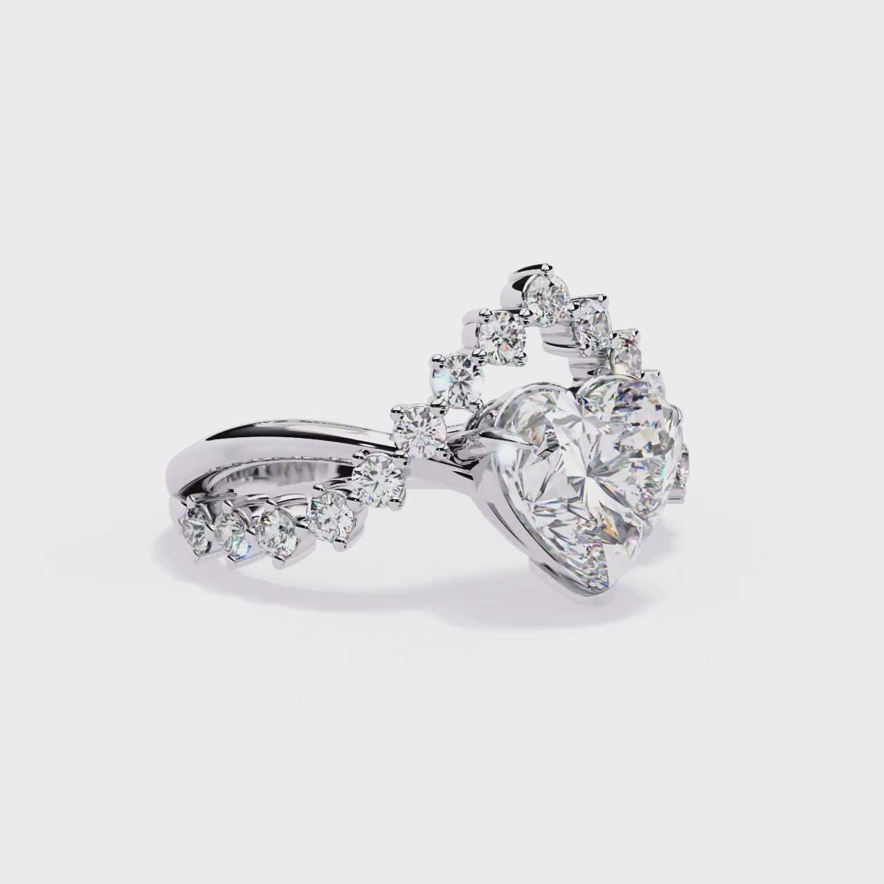 360 view video of heart shape lab diamond ring with crown style side stones rotating