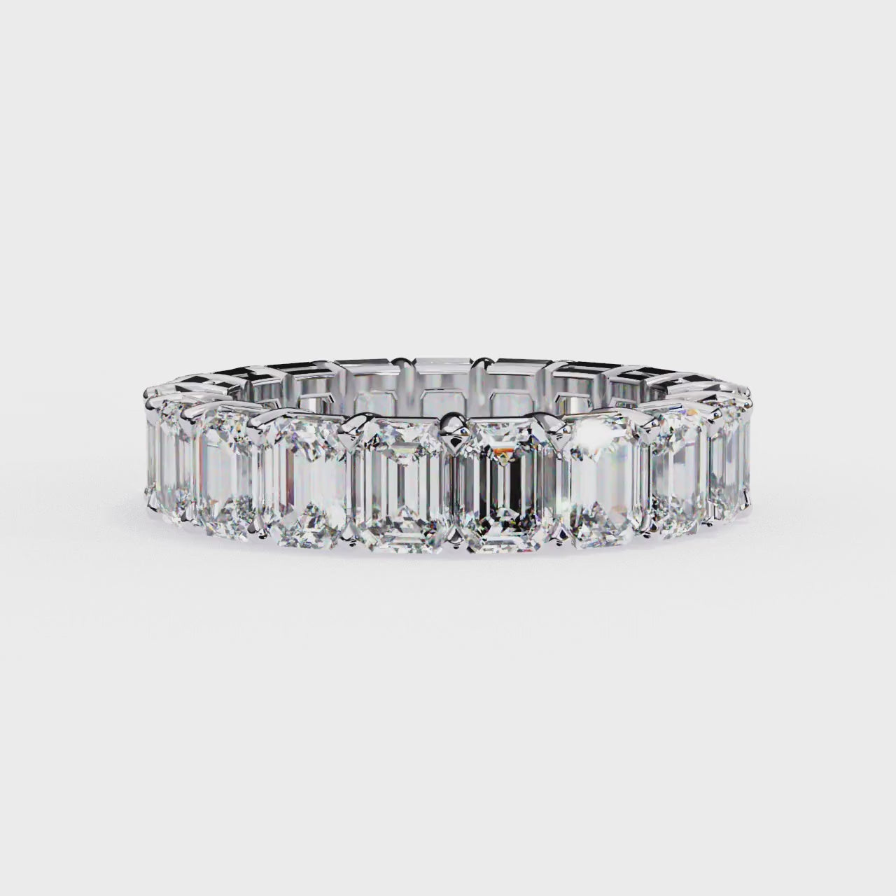 Modern eternity band ring with emerald cut stones
